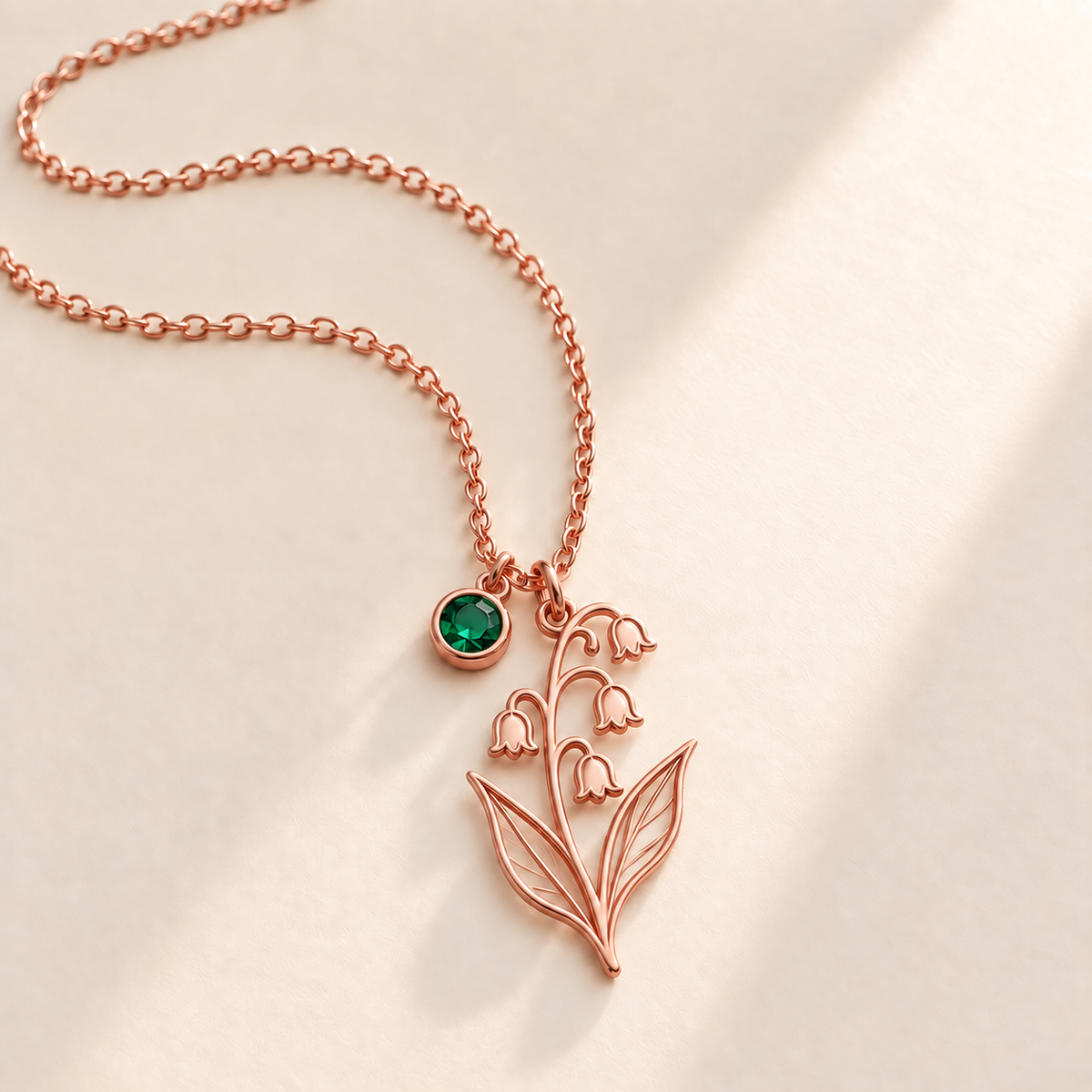 Custom Birth Flower & Birthstone Necklace hero photo - Rose Gold May lily of the valley birth flower charm with Emerald birthstone Anthology Jewelry