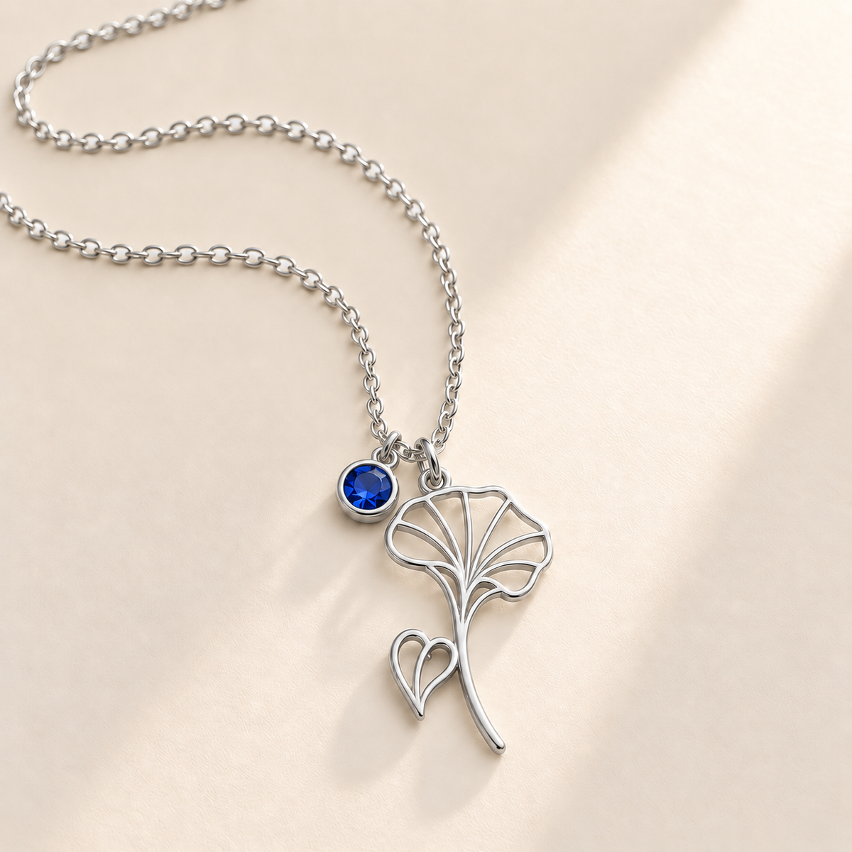 Custom Birth Flower & Birthstone Necklace hero photo - Silver September morning glory birth flower charm with Sapphire birthstone Anthology Jewelry