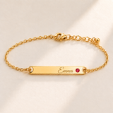 Birthstone Bar Bracelet hero photo - gold july ruby with Emma engraving in Great Vibes Anthology Jewelry