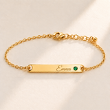 Birthstone Bar Bracelet hero photo - gold may emerald with Emma engraving in Great Vibes Anthology Jewelry