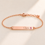 Birthstone Bar Bracelet hero photo - rose gold october tourmaline with Clara engraving in Playfair Display Anthology Jewelry