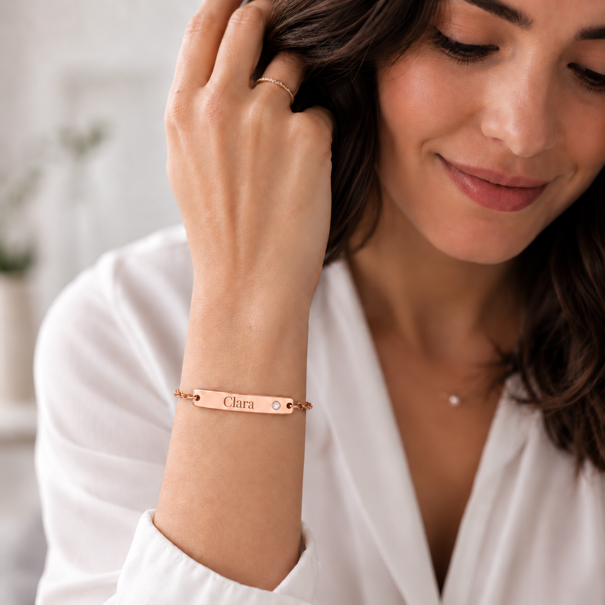 Birthstone Bar Bracelet UGC lifestyle photo - rose gold Clara engraving and smaller round clear gemstone Anthology Jewelry