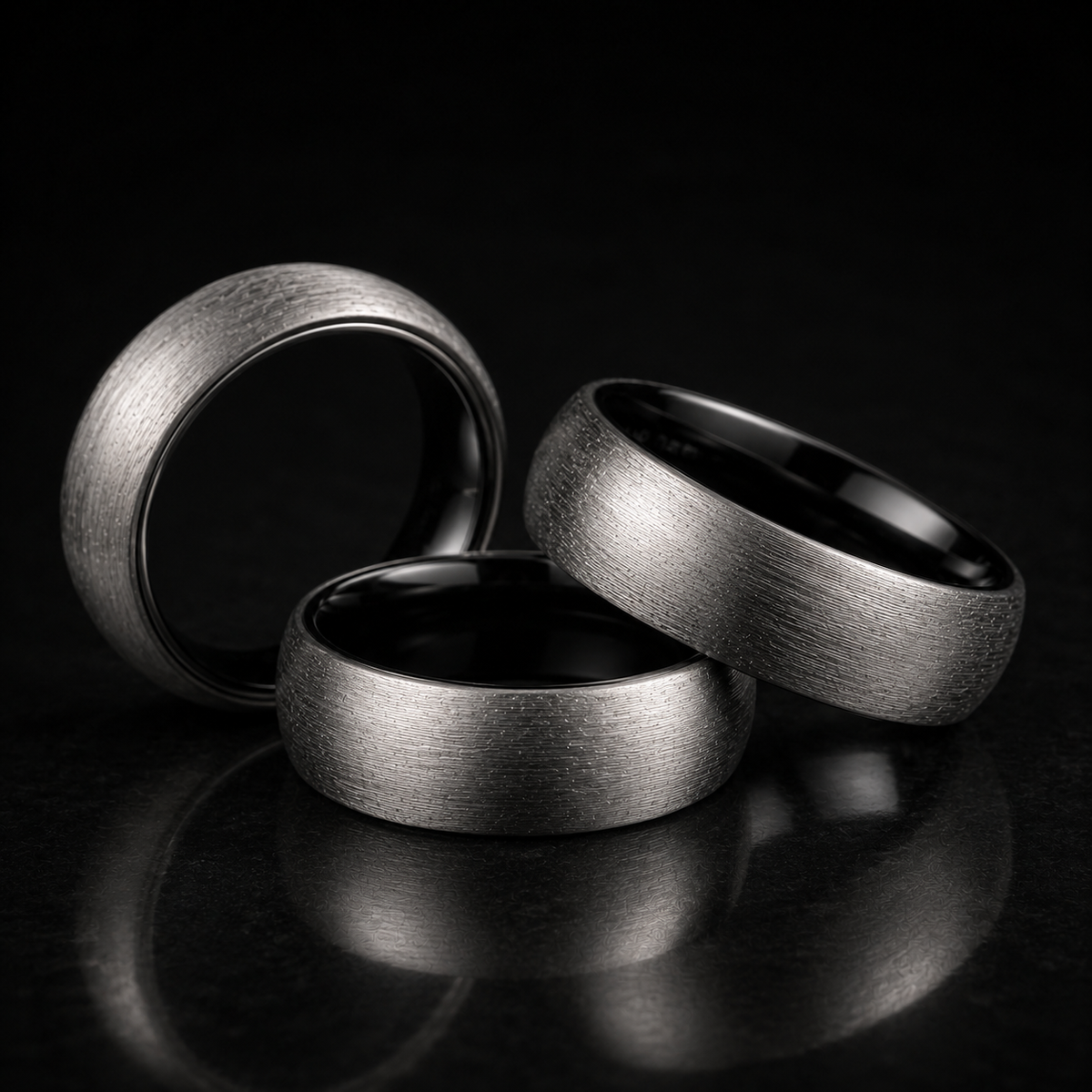 Man wearing a brushed tungsten two-toned ring while holding a coffee mug - Anthology Jewelry
