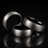 Man wearing a brushed tungsten two-toned ring while holding a coffee mug - Anthology Jewelry