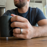 Three brushed tungsten two-toned rings grouped together showing brushed exterior and black interior - Anthology Jewelry