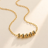 Custom Add-A-Bead Necklace hero photo - gold paperclip chain necklace with engraved name beads Anthology Jewelry