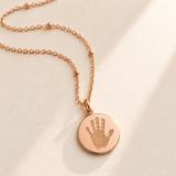 Custom Baby Handprint or Footprint Necklace hero photo - rose gold engraved baby handprint disc pendant on satellite chain Anthology Jewelry