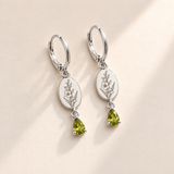 Custom Birth Flower & Birthstone Drop Earrings august silver hero photo - engraved gladiolus stem with multiple flowers and buds and long pointed leaves with yellow-green peridot pear stones Anthology Jewelry