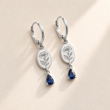 Custom Birth Flower & Birthstone Drop Earrings hero photo - silver morning glory and sapphire earrings Anthology Jewelry