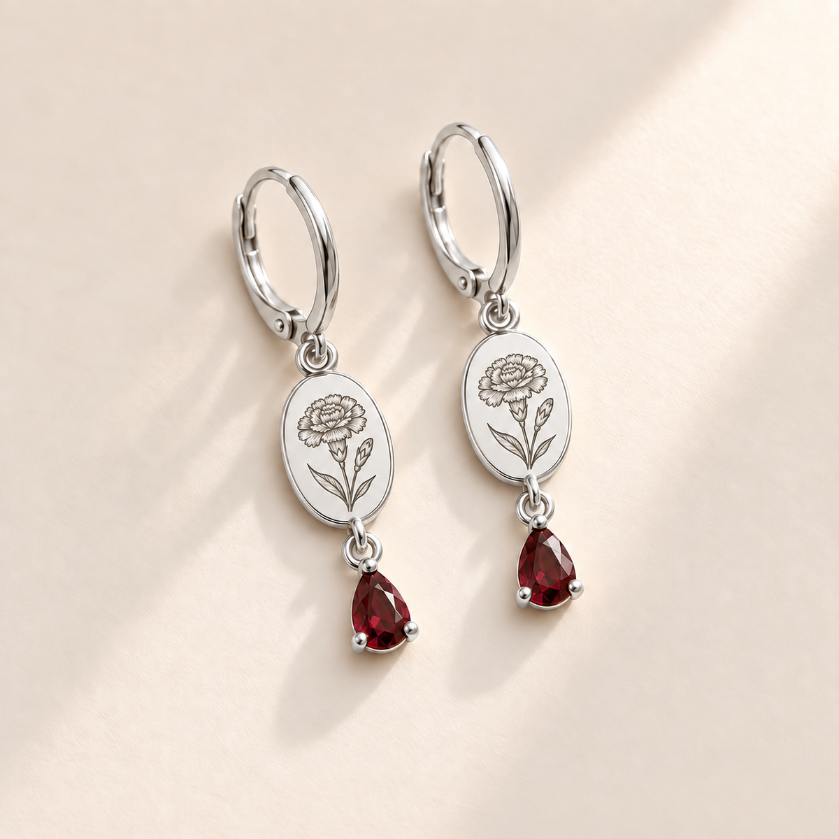 Custom Birth Flower & Birthstone Drop Earrings january silver hero photo - engraved carnation flower with ruffled petals, right bud, narrow leaves with dark garnet red pear stones Anthology Jewelry