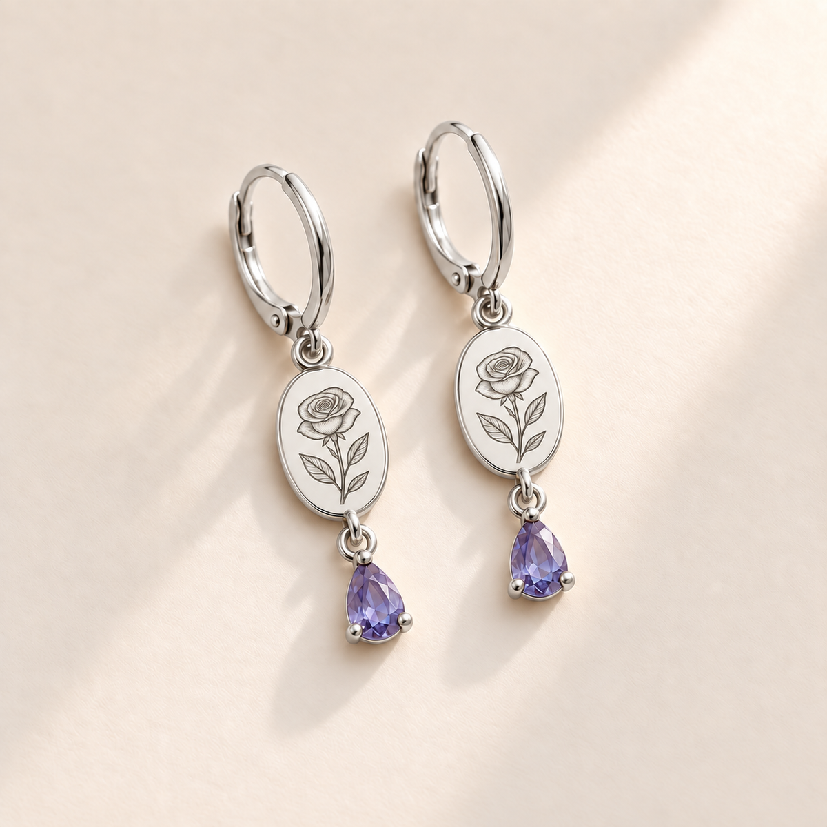 Custom Birth Flower & Birthstone Drop Earrings june silver hero photo - engraved rose with layered petals and three leaves with pale lavender violet pear stones Anthology Jewelry