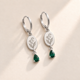 Custom Birth Flower & Birthstone Drop Earrings may silver hero photo - engraved four small downward lily-of-the-valley bells and two broad leaves with deep emerald green pear stones Anthology Jewelry
