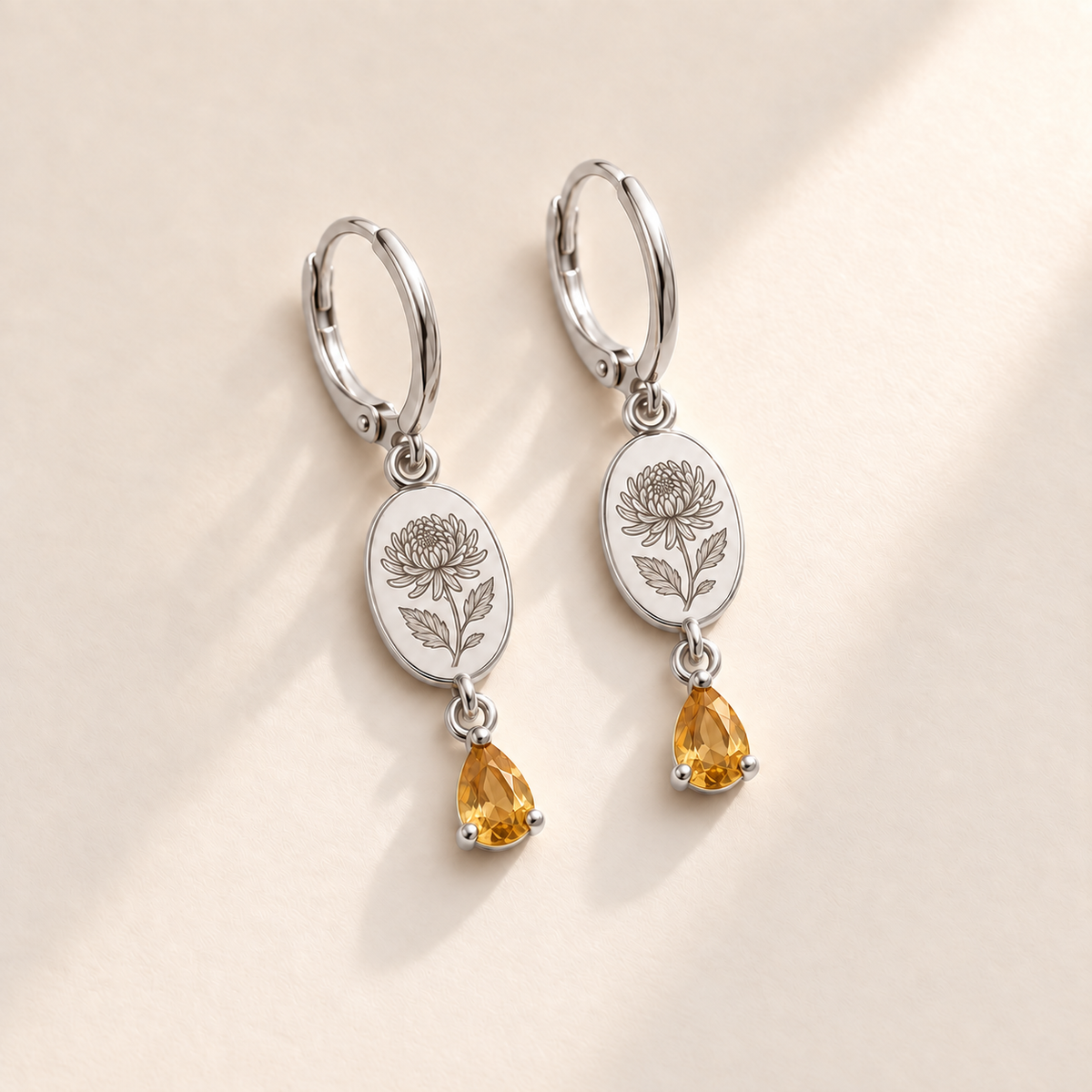 Custom Birth Flower & Birthstone Drop Earrings november silver hero photo - engraved chrysanthemum with elongated curled petals and serrated leaves with golden yellow citrine pear stones Anthology Jewelry