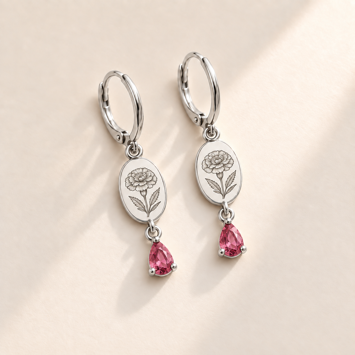 Custom Birth Flower & Birthstone Drop Earrings october silver hero photo - engraved round marigold flower with dense layered petals and serrated leaves with pink tourmaline pear stones Anthology Jewelry