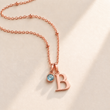 Custom Birthstone Initial Necklace rose gold March birthstone photo - serif initial B with round pale blue stone Anthology Jewelry