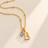 Custom Birthstone Initial Necklace stone march photo - two separate bails with serif initial B and round birthstone Anthology Jewelry