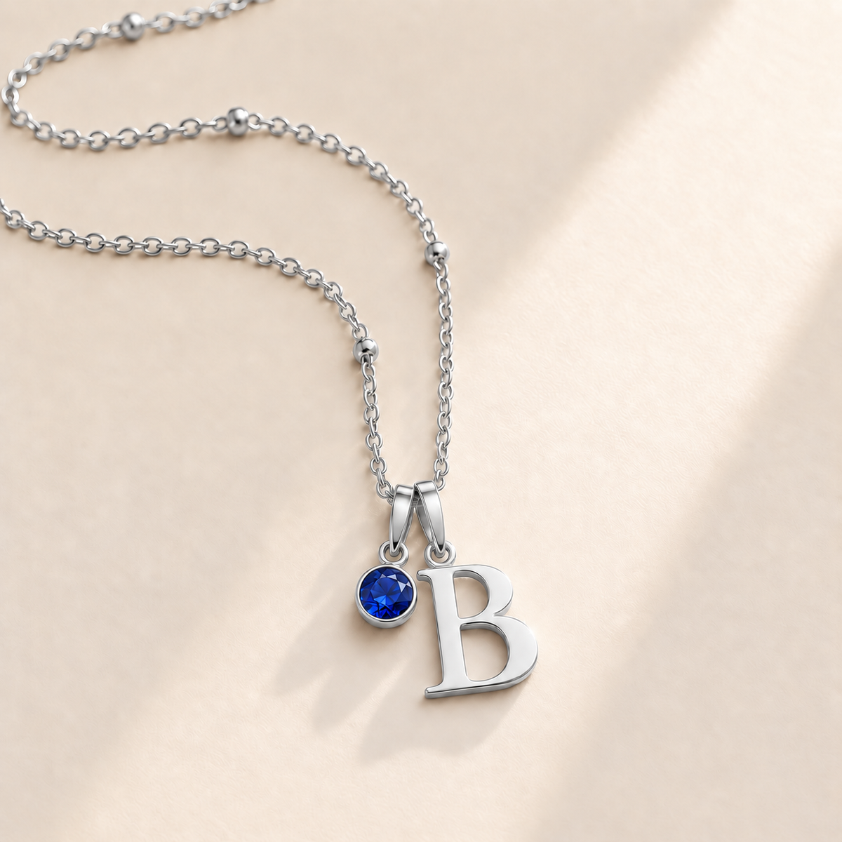 Custom Birthstone Initial Necklace september silver birthstone photo - serif initial B with round birthstone Anthology Jewelry
