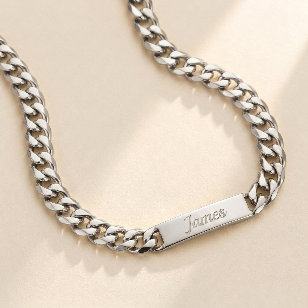 Custom Chunky Chain Nameplate Necklace hero photo - silver curb chain necklace with engraved nameplate tag on cream background Anthology Jewelry