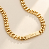 Custom Chunky Chain Nameplate Necklace hero photo - gold curb chain necklace with engraved nameplate tag on cream background Anthology Jewelry