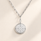 Custom Compass Initial Necklace silver compass pendant on pale ivory background Anthology Jewelry