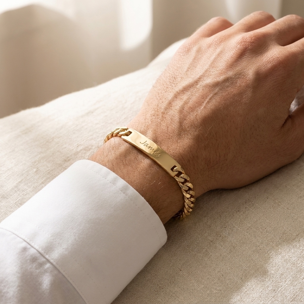 Custom Curb Chain ID Bracelet lifestyle photo - man wearing gold curb chain ID bracelet with white shirt cuff Anthology Jewelry