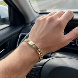 Custom Curb Chain ID Bracelet UGC photo - engraved gold curb chain bracelet worn while driving Anthology Jewelry