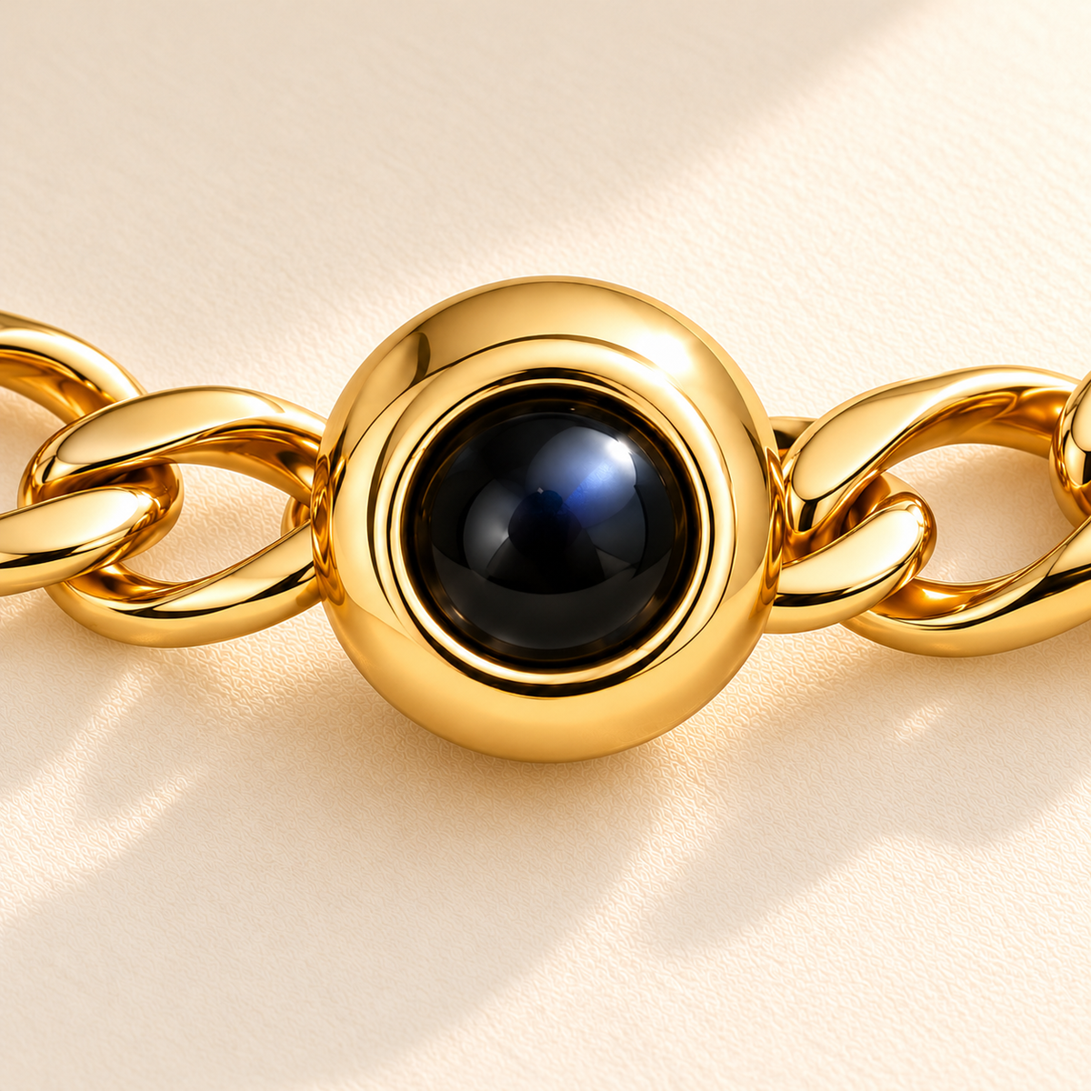 Custom Curb Link Photo Bracelet macro detail in Gold showing dark projection lens and direct open curb-link connections - Anthology Jewelry
