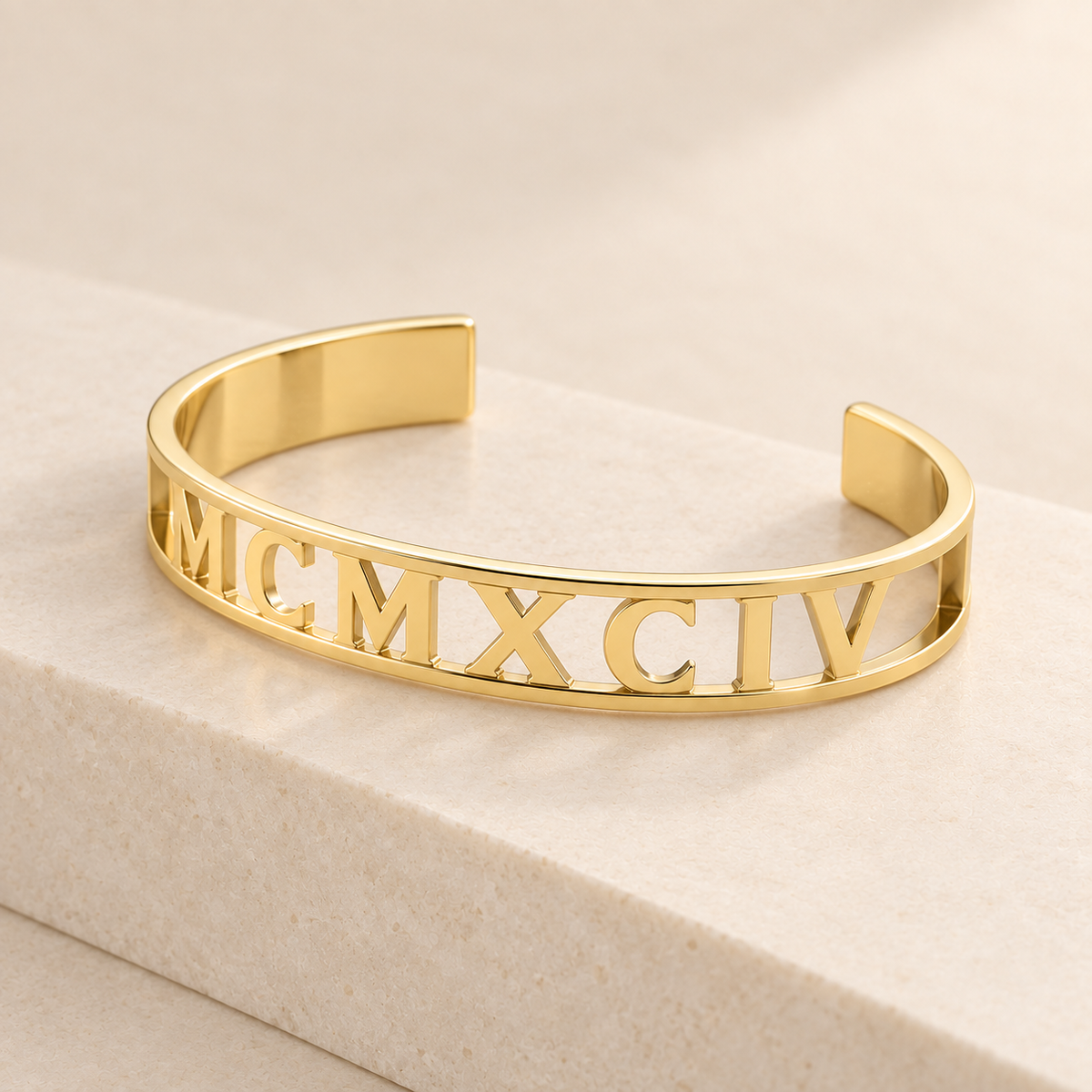 Custom Cut Out Cuff glamour photo - gold openwork cuff on cream stone plinth Anthology Jewelry