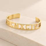 Custom Cut Out Cuff glamour photo - gold openwork cuff on cream stone plinth Anthology Jewelry