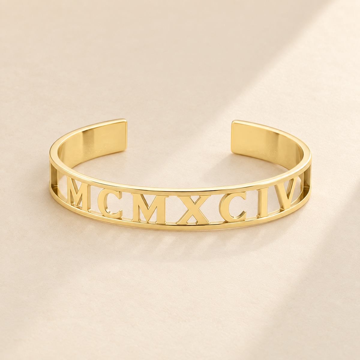 Custom Cut Out Cuff hero photo - gold MCMXCIV openwork cuff Anthology Jewelry