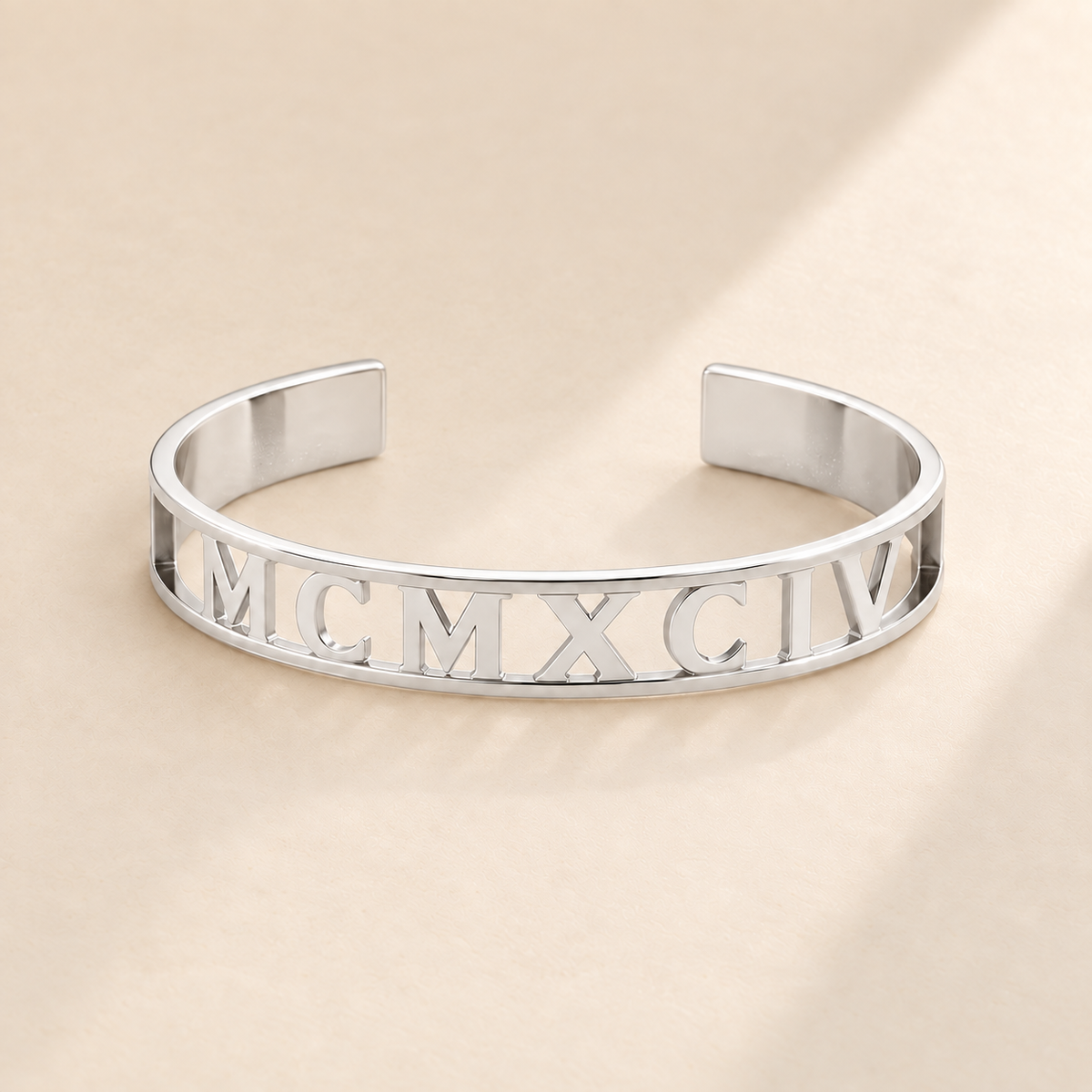 Custom Cut Out Cuff hero photo - silver MCMXCIV openwork cuff Anthology Jewelry