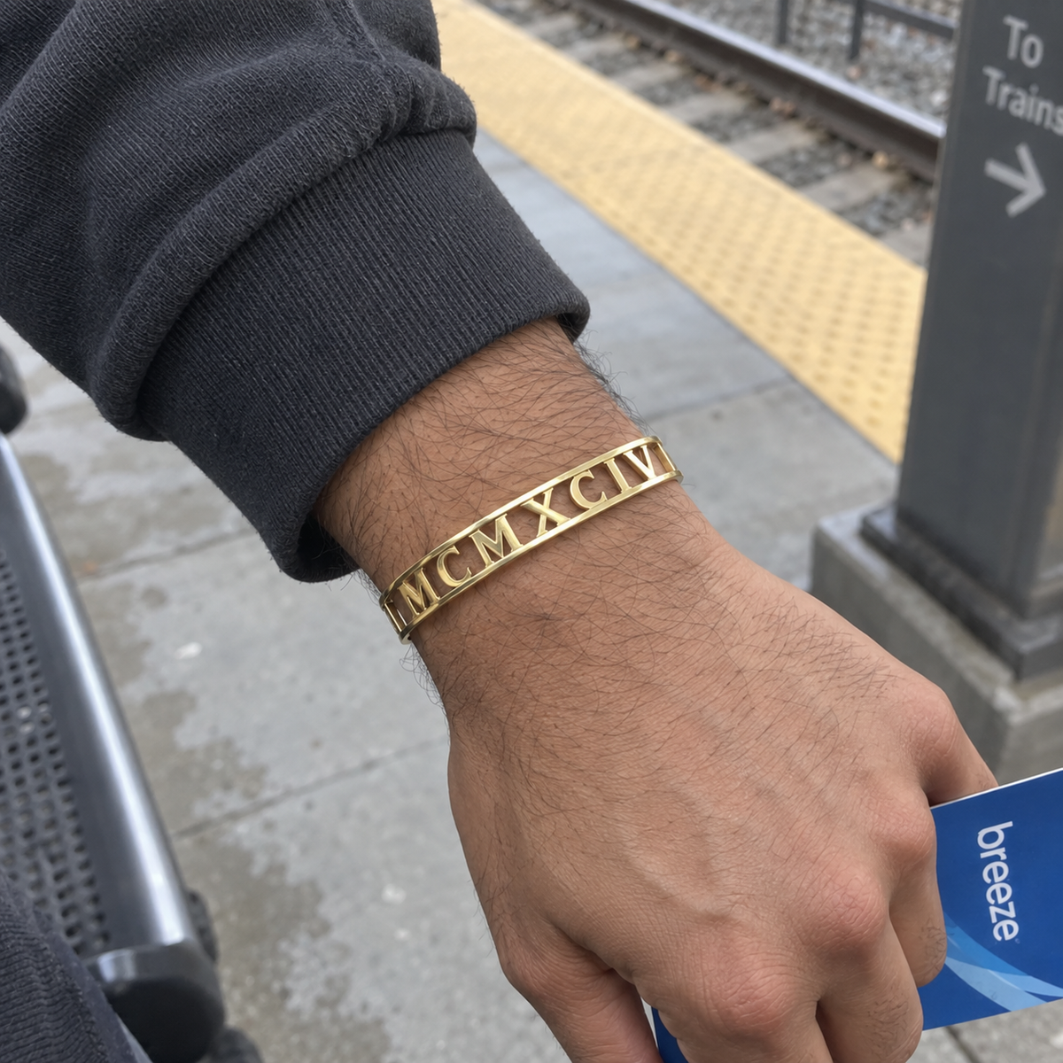 Custom Cut Out Cuff customer-style photo - gold openwork cuff at transit platform Anthology Jewelry
