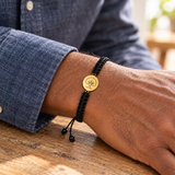 Custom Drawing Bracelet | Men's Black Braided Cord professional-lifestyle photo - gold hand-drawn tree engraving, generated design concept Anthology Jewelry