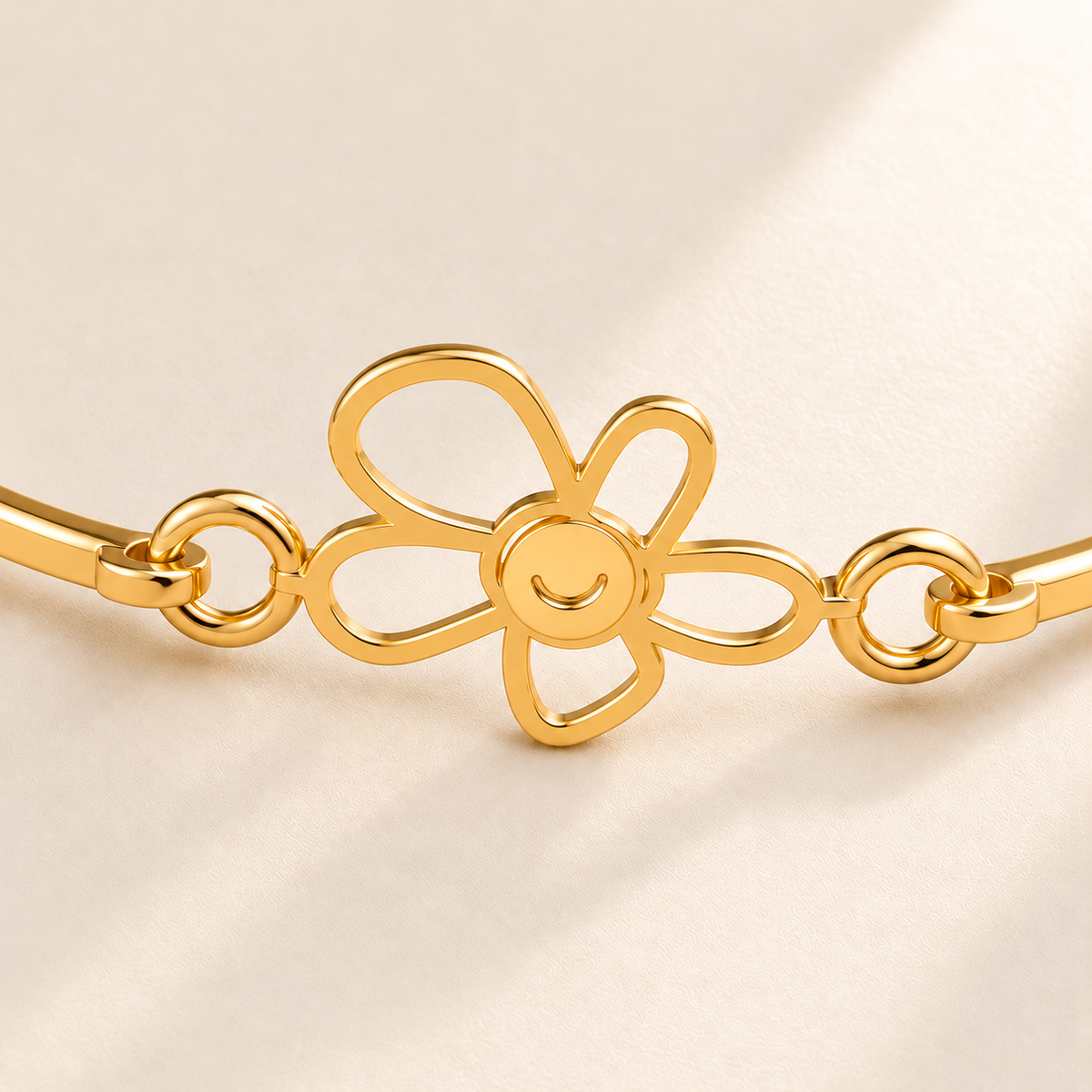 Custom Drawing Cuff Bracelet macro detail photo - gold five-petal open flower with connected solid gold center and smile detail, Anthology Jewelry