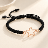 Custom Drawing Cutout Bracelet | Men's Black Braided Cord glamour photo - rose gold open star outline on black braided cord styled beside a ceramic dish, design concept Anthology Jewelry