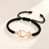 Custom Drawing Cutout Bracelet | Men's Black Braided Cord hero photo - rose gold open hand-drawn fish, generated design concept Anthology Jewelry