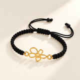 Custom Drawing Cutout Bracelet | Men's Black Braided Cord hero photo - gold open flower centerpiece on black braided cord, design concept Anthology Jewelry