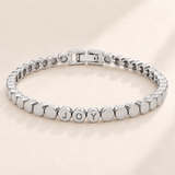 Custom Engraved Dot Bracelet hero photo - silver linked round beads with engraved letters Anthology Jewelry