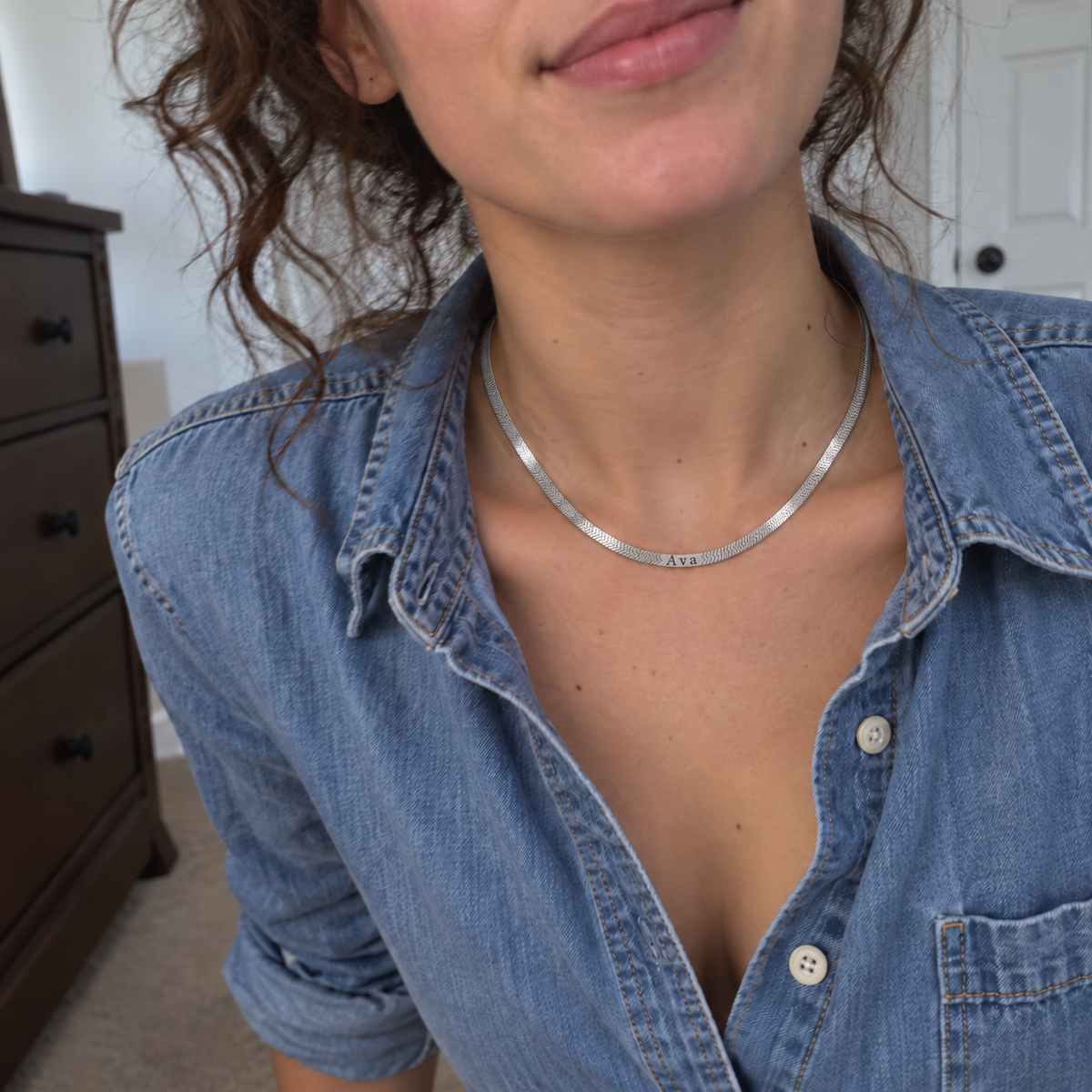 Custom Engraved Herringbone Necklace UGC-style photo - silver finish with Ava personalization Anthology Jewelry