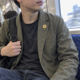 Custom Fingerprint Lapel Pin UGC photo - gold fingerprint pin worn on jacket lapel while commuting on train Anthology Jewelry