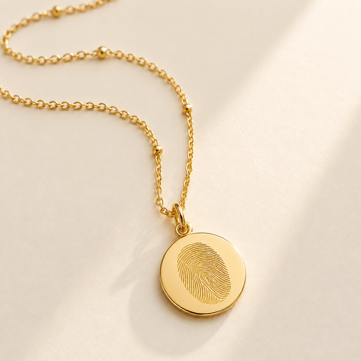 Custom Fingerprint Necklace lifestyle photo - engraved fingerprint pendant Anthology Jewelry.