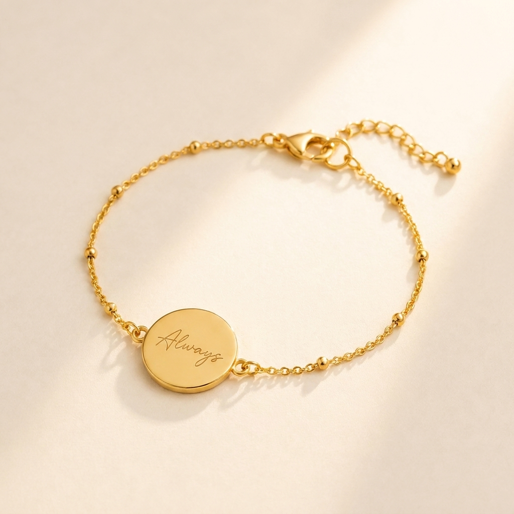 Custom Handwriting Bracelet Disc Pendant hero photo - gold disc bracelet engraved with handwriting on cream background Anthology Jewelry