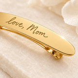 Custom Handwriting Hair Barrette detail photo - macro closeup of engraved handwriting on gold barrette Anthology Jewelry