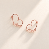 Custom Heart-Frame Name Stud Earrings rose gold variant hero on pale ivory background - Anthology Jewelry