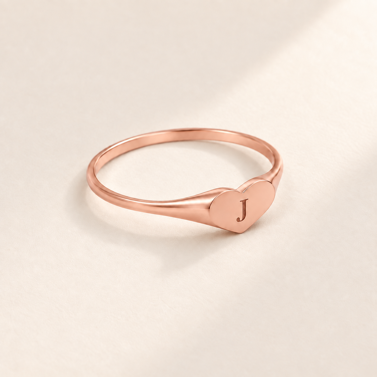 Custom Heart Signet Initial Ring hero photo - rose gold heart signet ring with an engraved initial Anthology Jewelry
