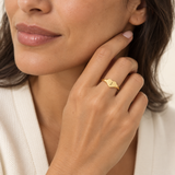 Custom Heart Signet Initial Ring lifestyle photo - gold heart signet ring with engraved initial worn on the hand Anthology Jewelry