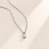 Custom Initial Lock Necklace hero silver photo - tiny closed padlock on paperclip chain Anthology Jewelry