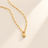 Custom Initial Lock Necklace hero photo - tiny closed padlock on paperclip chain Anthology Jewelry