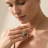 Custom Keepsake Oval Photo Necklace lifestyle photo - woman holding gold oval photo pendant necklace Anthology Jewelry