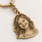 Custom Laser-Cut Portrait Keychain detail photo - close view of engraved child portrait on gold keychain Anthology Jewelry